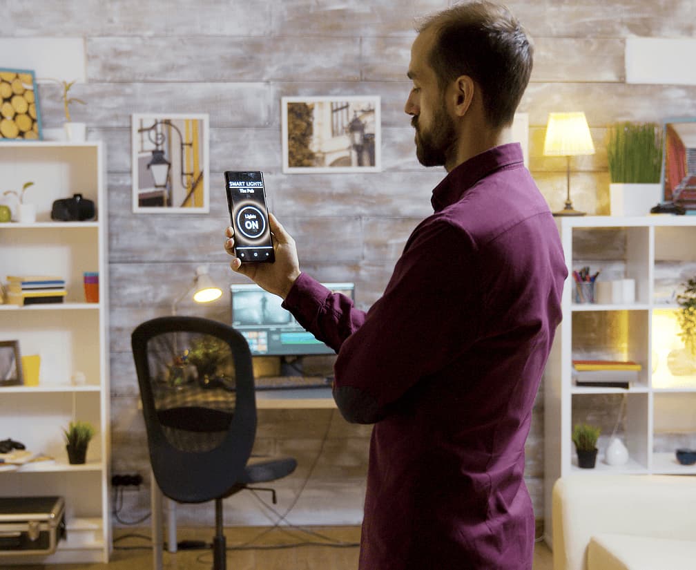 Homeowner controlling lighting from a phone